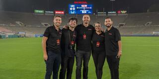 Five people standing on a field