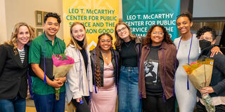 faculty and students smiling together