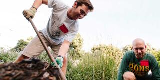 Students using a shovel