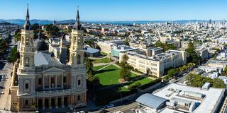 Panorama image of the USF campus with downtown in the background