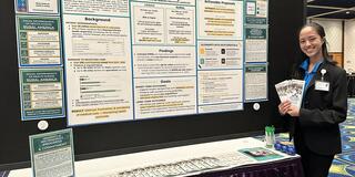 Student presenting a poster