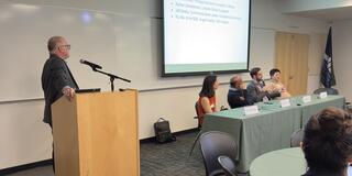 Thomas Maier moderates panel discussion