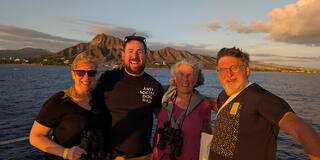 Slosberg family on a boat in the ocean