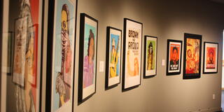 Installation photograph featuring prints by Taller Tupac Amaru