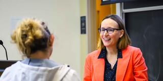 Person talking with another person in classroom