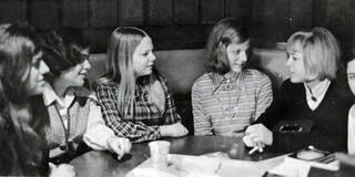Group of women sitting around the table