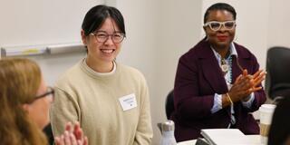 Kimberly Tseng meeting with two colleagues
