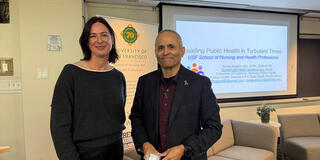 Dr. Tomás J. Aragón stands with a usf community member