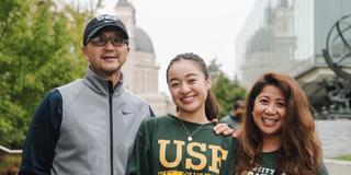 Megan Madlangbayan, center, with parents