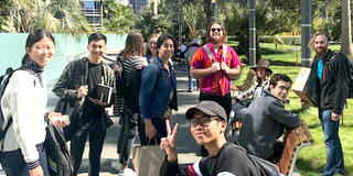 students pose on walking tour