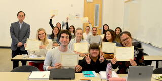USF's Masters in Asia Pacific Studies students holding certificates
