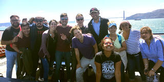 Students from the institute pose in front of the bay and Golden Gate Bridge