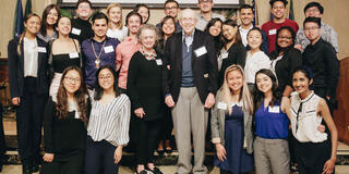 Alumni in a group shot with students