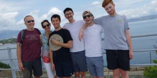 Group photo by the water