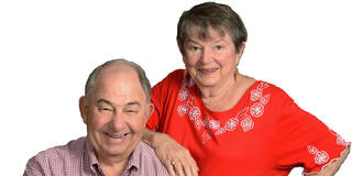 Man and woman sitting in a posed position