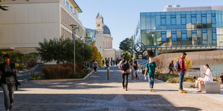 Students walking through USF campus.