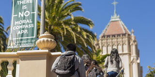 Students on the Lone Mountain steps with banner visible