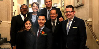 USF alumnus Mayordomo (center) and the St. Regis Executive Committee