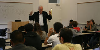 Economics Professor Hartmut Fischer giving a lecture