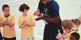 Jerome Gumbs works with kids in the Empower Me Academy