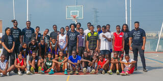 Khadijah Suleman (center) with kids at her SportsxSTEM camp