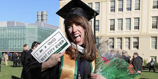 Student with cap and gown