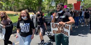 Whitney Smith ’22, second from left, helps lead Black Lives Matter march at Lake Merritt.