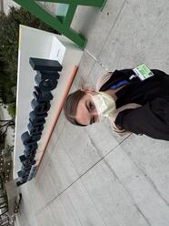 Student taking a selfie with a mask and scrubs on