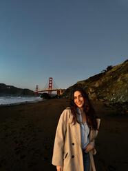 Iklim Uluca standing near the Golden Gate Bridge