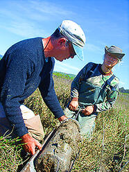 John Callaway (left), associate professor of environmental science, and research assistant Evyan Borgnis '08 (right), prepare soil samples as part of their research.