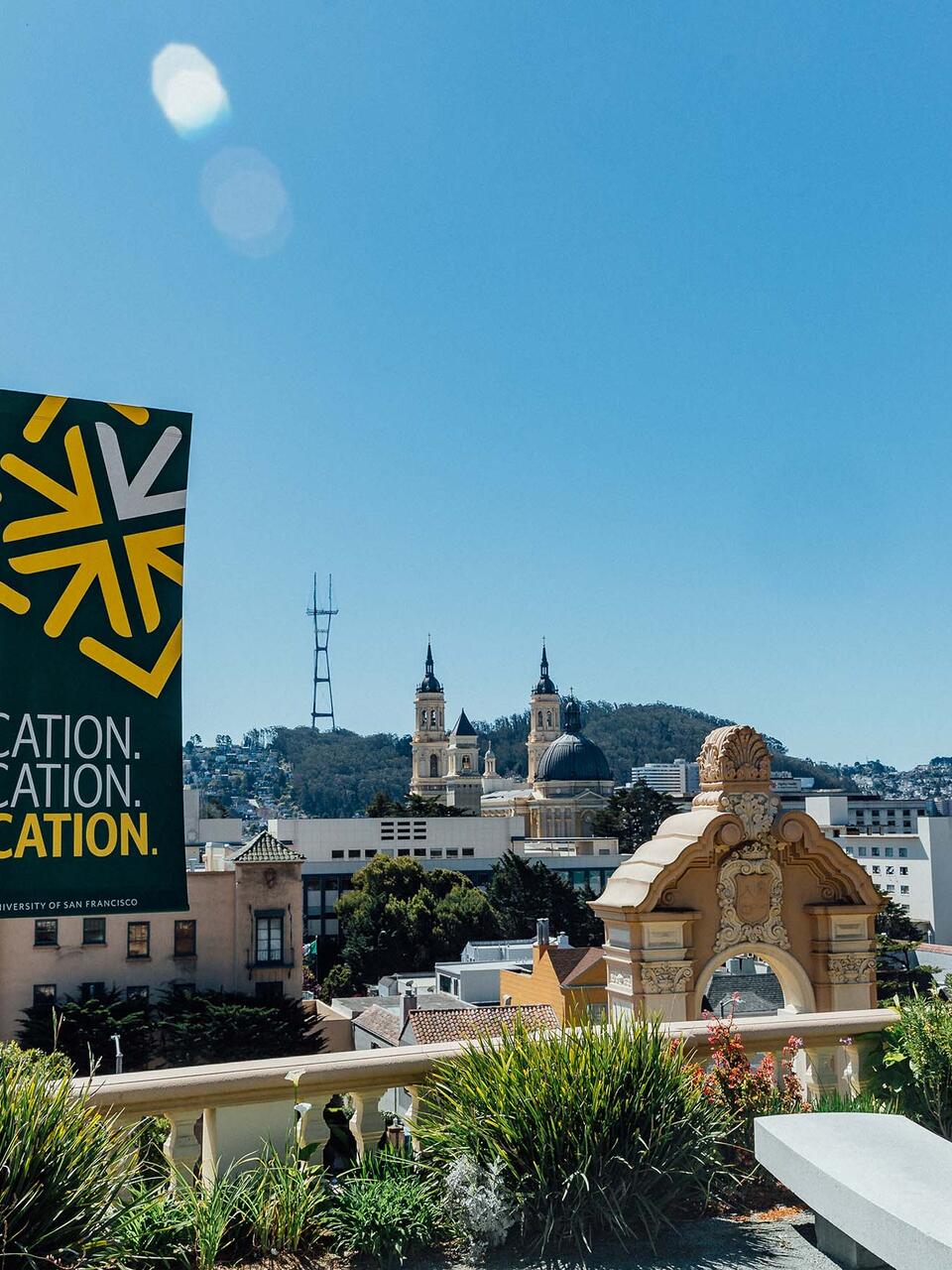 View from the top of Lone Mountain steps and a banner reading "Location. Location. Location."