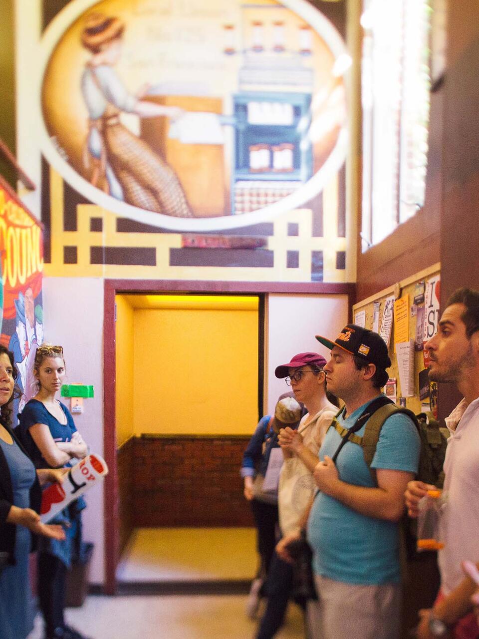 Students tour a colorful part of the history of the Mission district.