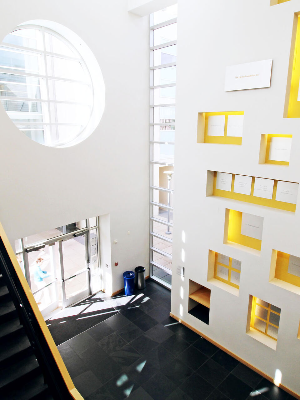 Lobby of Zief Library with a wall of colorful boxes.