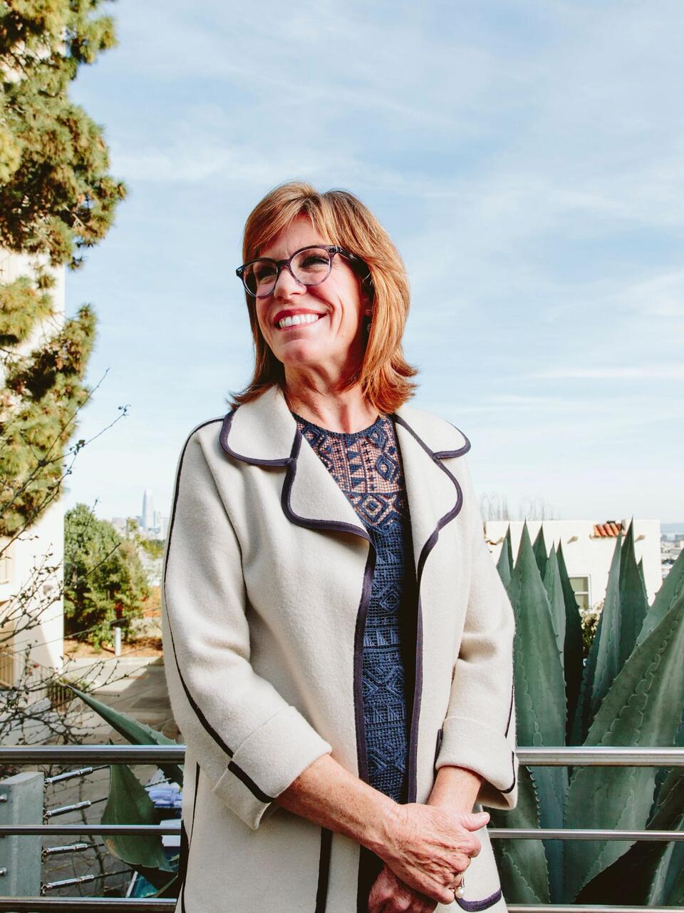 Linda Hothem MSOD '04 stands on balcony