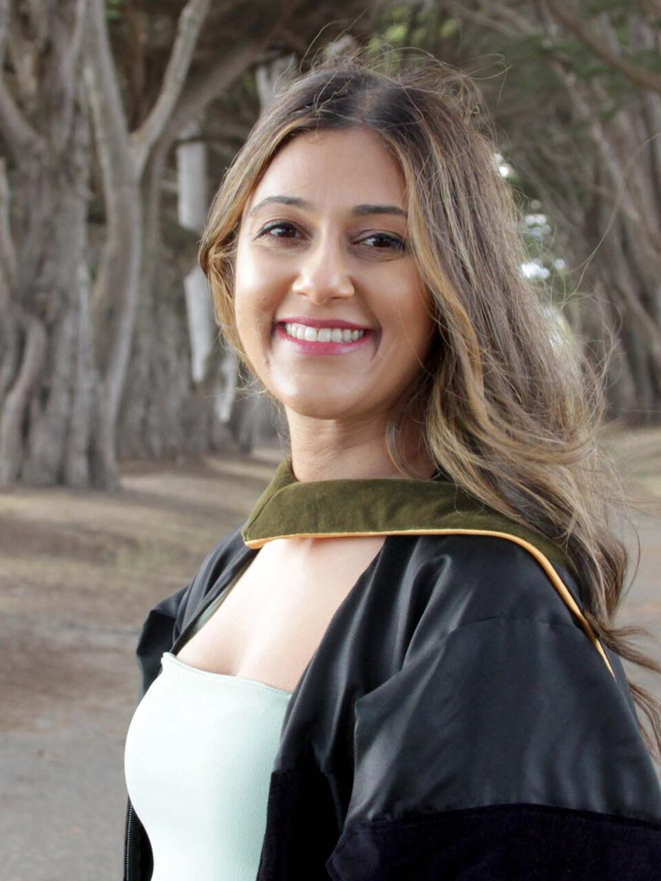 Ana Najafi in in her commencement robe at Golden Gate Park
