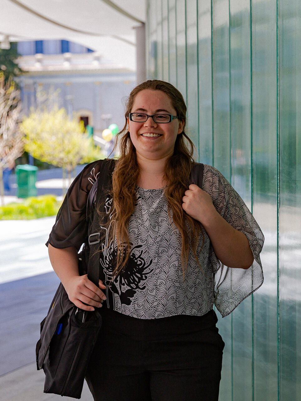 Law student standing on campus.