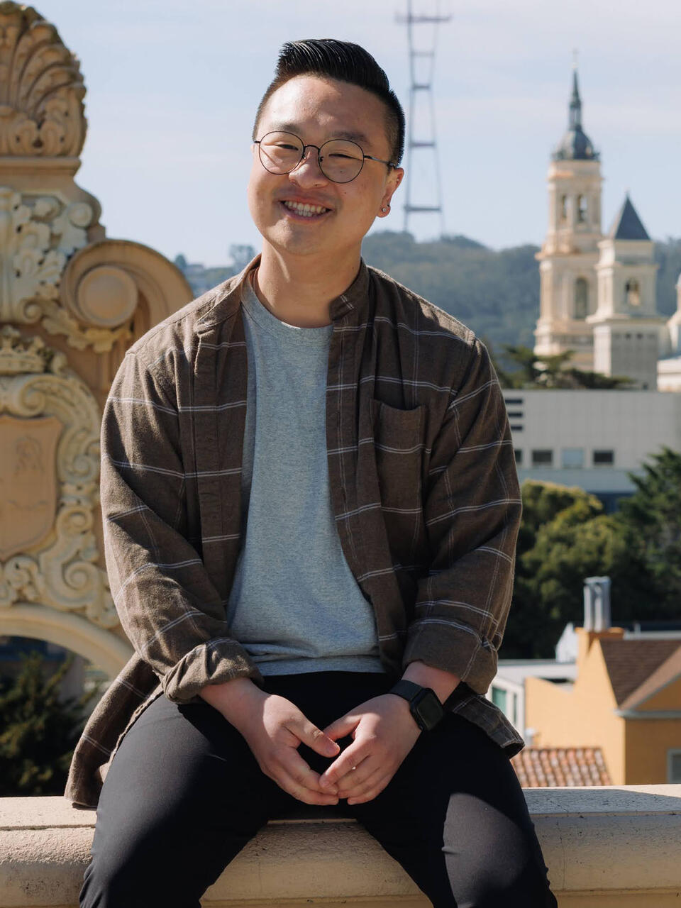 Evan Matthew Chan sitting atop the Spanish steps