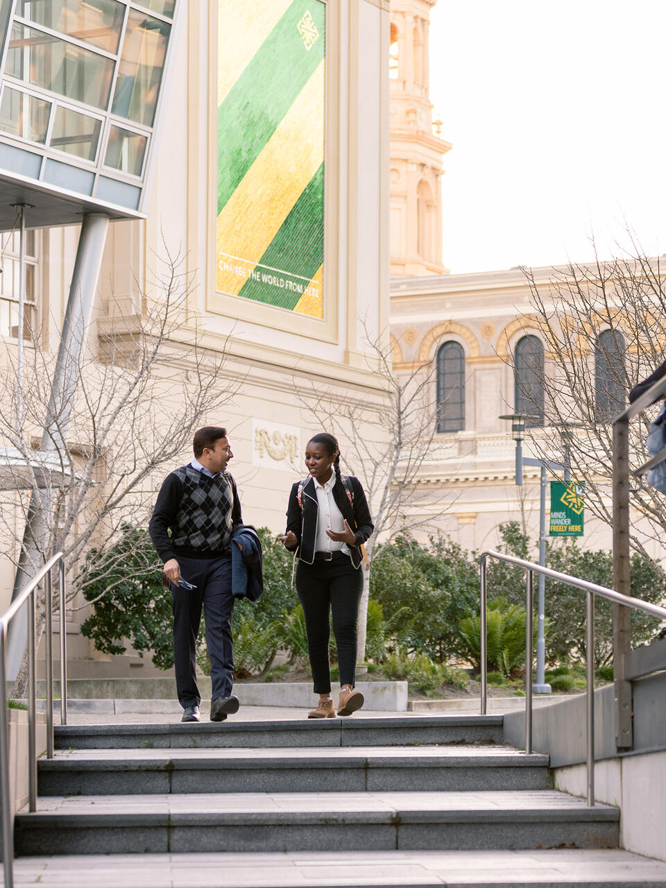 two students walking outside on USF campus