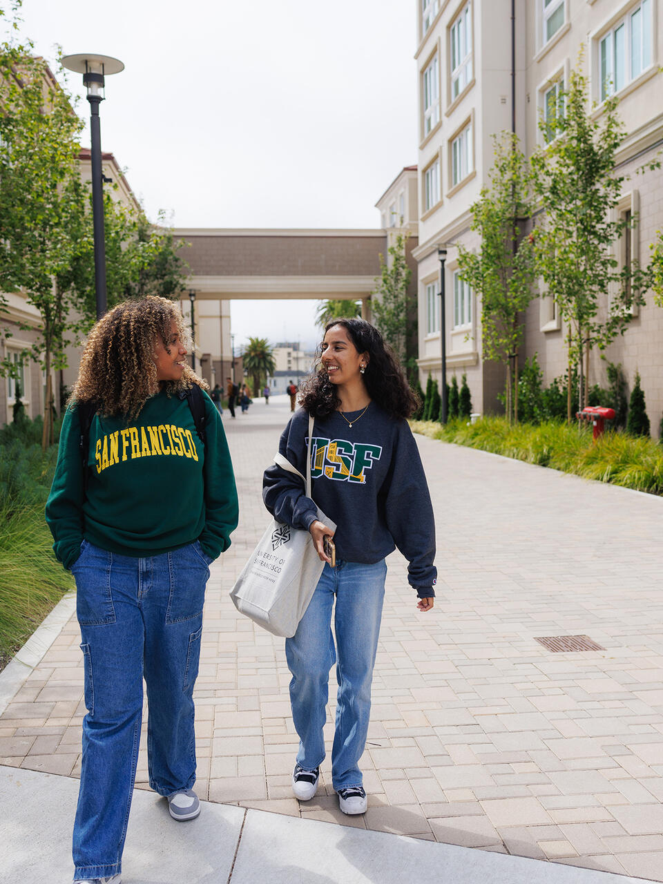 students walking outside on campus