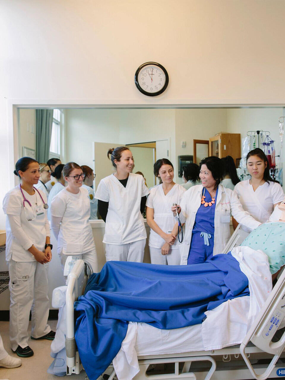 USF nursing students smiling in a lab