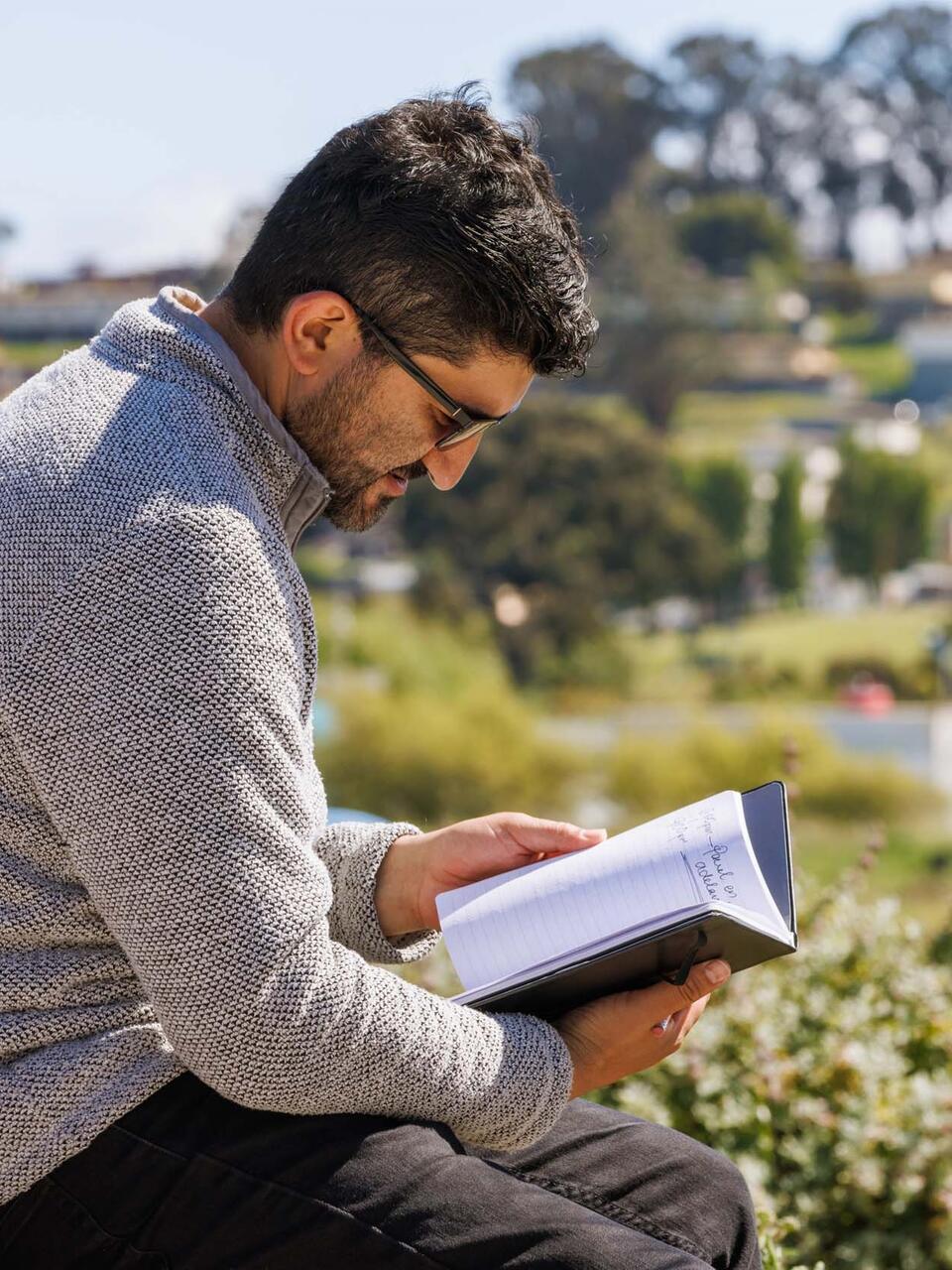 Student reading outside.